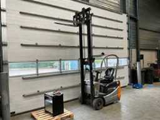 Online veiling Opruiming magazijn: heftrucks, magazijnstellingen, rollenbanen en transportbanden